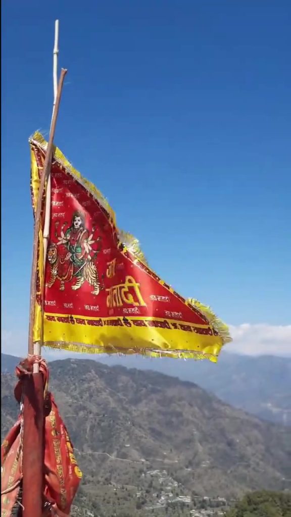 Flags of Kunjapuri Devi above the Bhagirathi valley