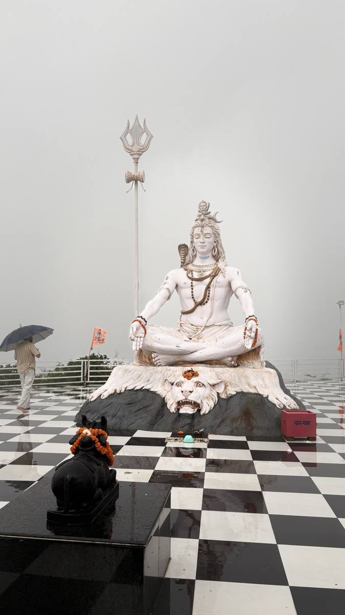 Matogi Shiva Temple Lord Shiva statue in monsoon mist near Dehradun